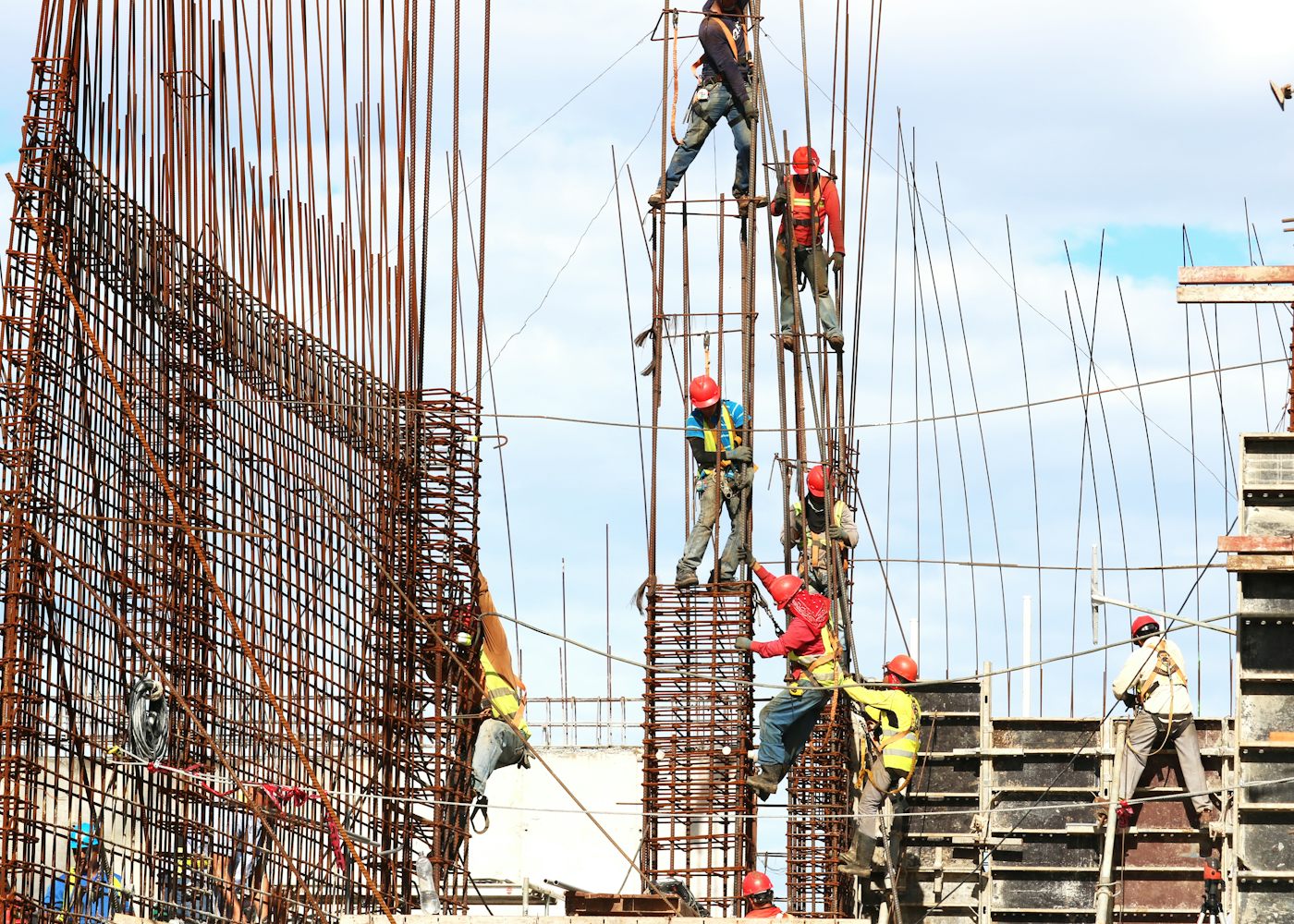 Commercial construction crew working at height on a commercial building